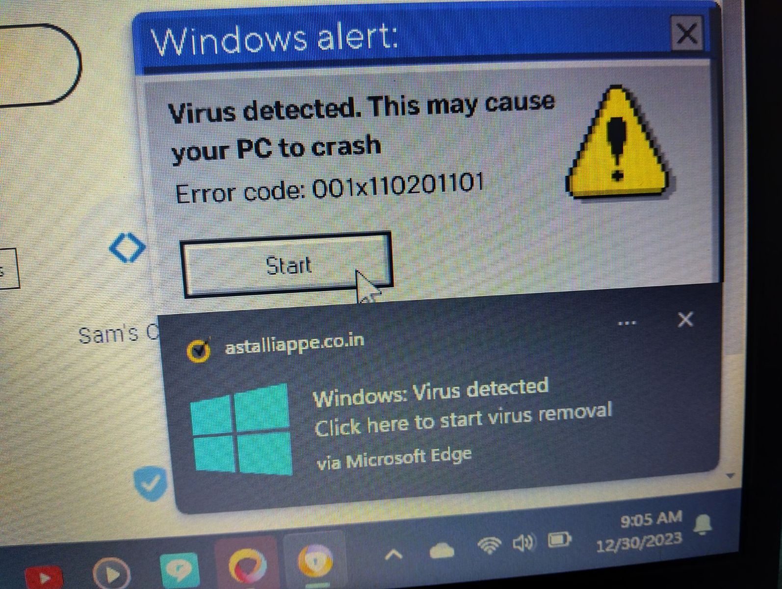 Fake anti-virus popup in browser. picture taken with mobile phone pointing at the computer screen
